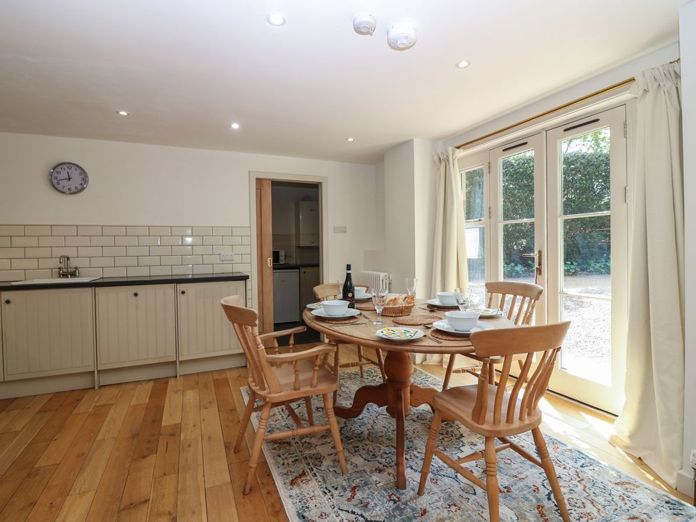 A kitchen with a dining table and chairs at Hollybank Barn near Melrose