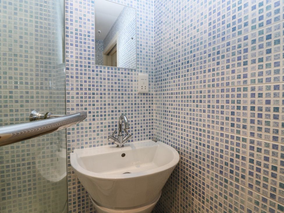 A bathroom with a sink and mirror at Hollybank Barn near Melrose