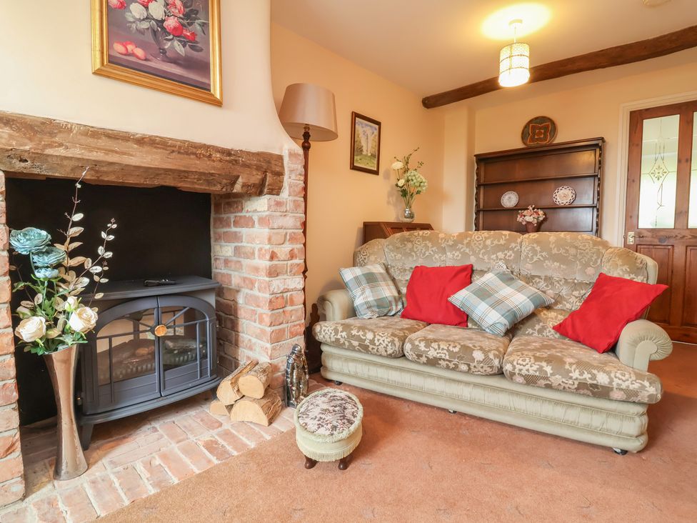 A living room with a sofa and fireplace at The Retreat near Wellington
