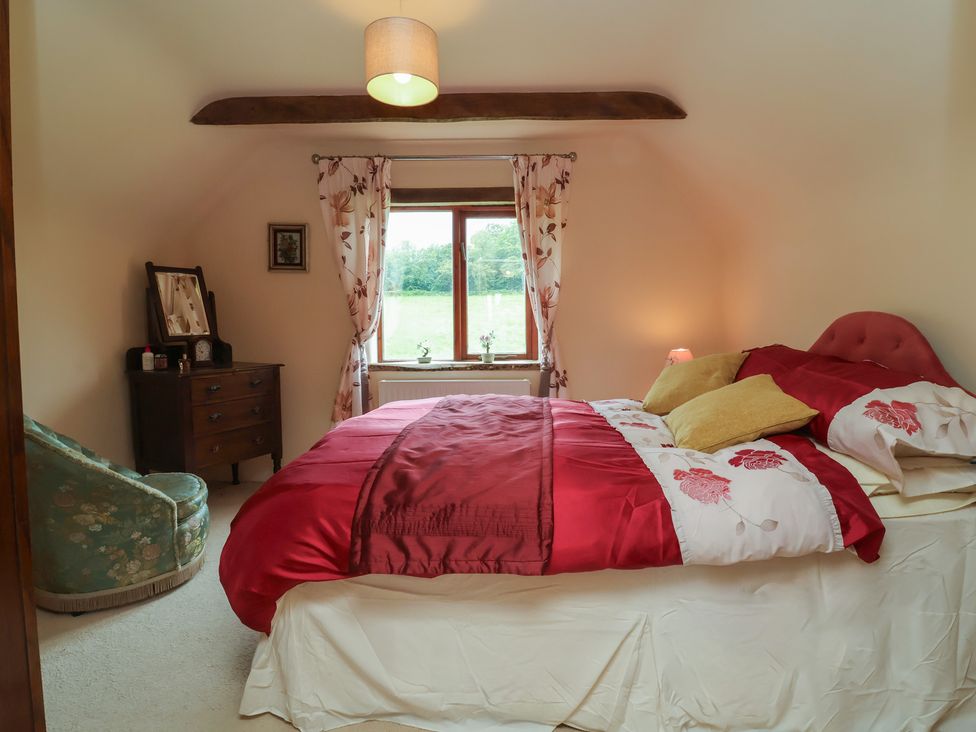 A bedroom with a bed and a dresser at The Retreat near Wellington