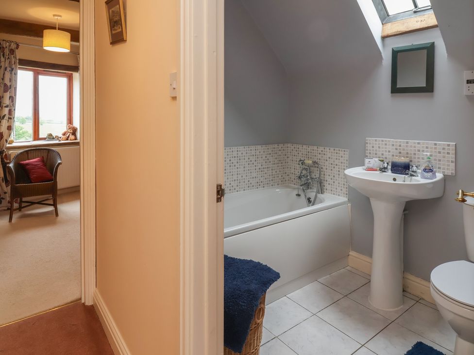 A bathroom with a bathtub and sink at The Retreat near Wellington