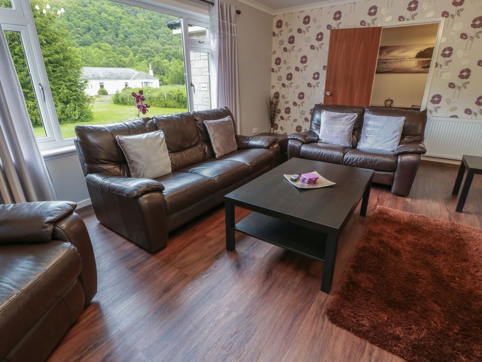 A living room with sofas and a coffee table at Cliff View in Perth