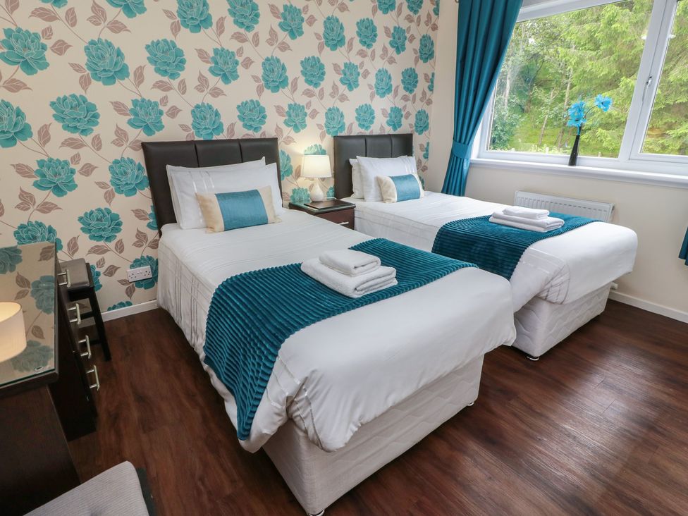 A bedroom with two beds and a window at Cliff View in Perth