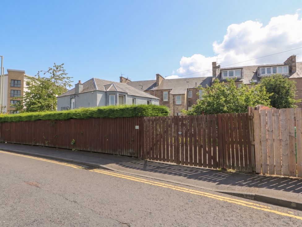 An outdoor view of houses and a fence in Perth