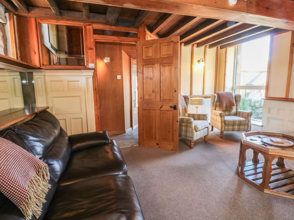 A living room with a sofa, armchairs, and a coffee table at Pearls Farm Two in Wildboarclough near Macclesfield