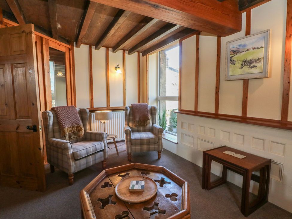 A snug with armchairs and a table at Pearls Farm Two Wildboarclough near Macclesfield