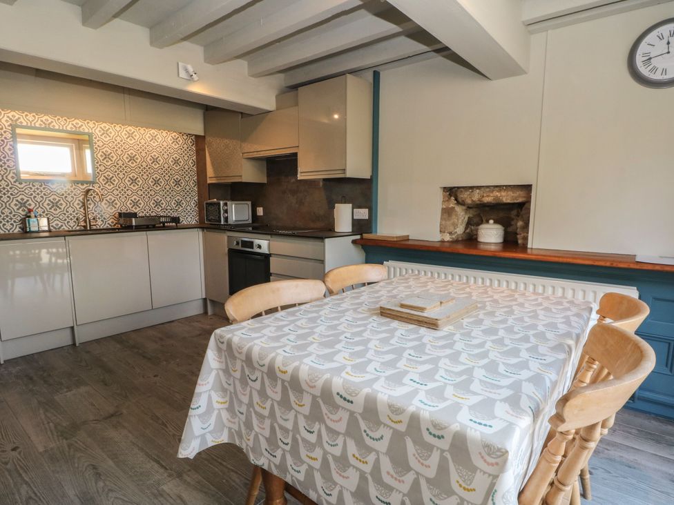 A kitchen with cabinets and appliances at Pearls Farm Two in Wildboarclough near Macclesfield