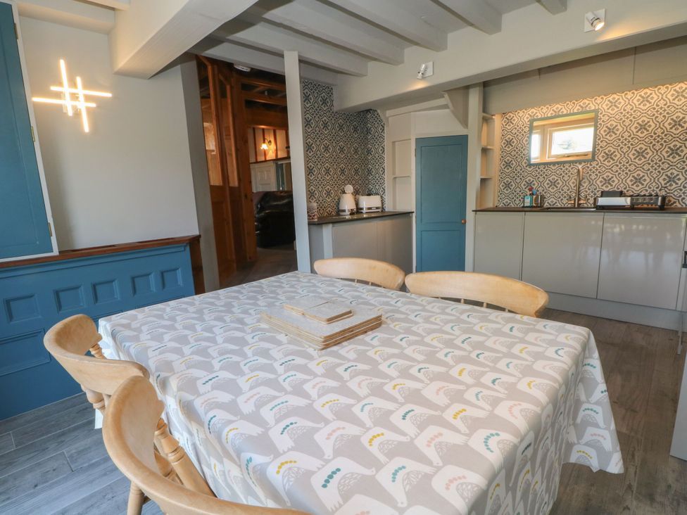 A dining room with a table and chairs at Pearls Farm Two Wildboarclough near Macclesfield