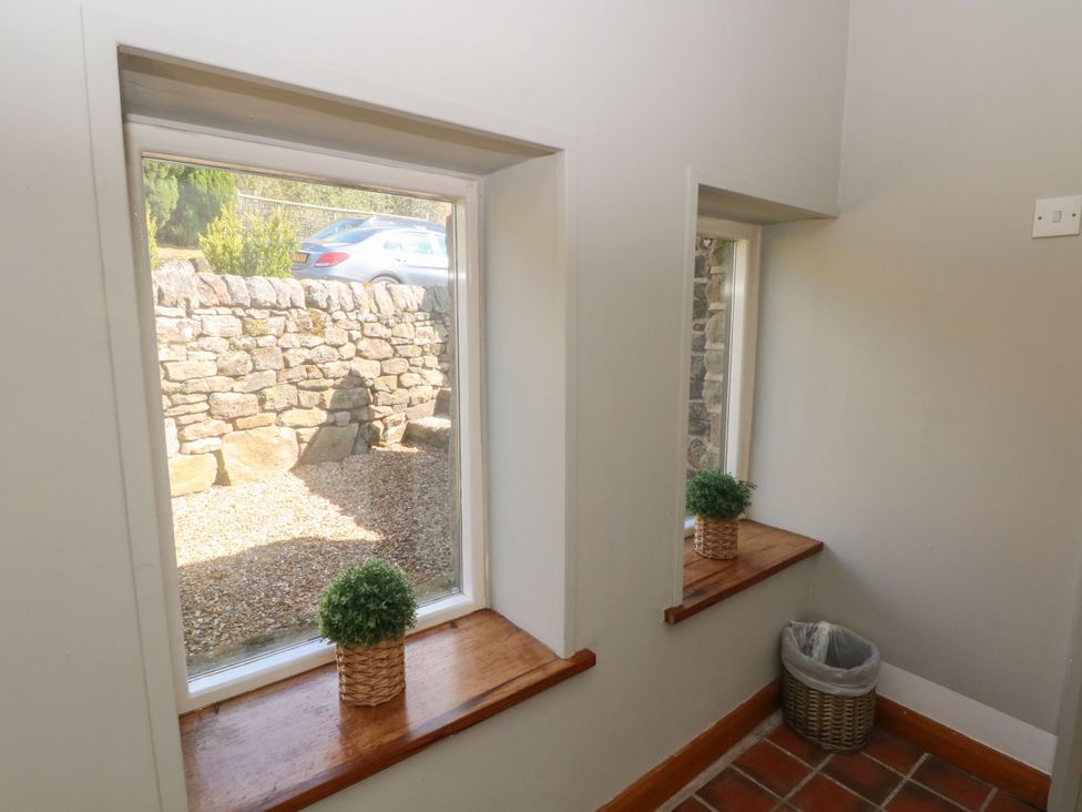 A hallway with windows and a plant at Pearls Farm Two Wildboarclough near Macclesfield