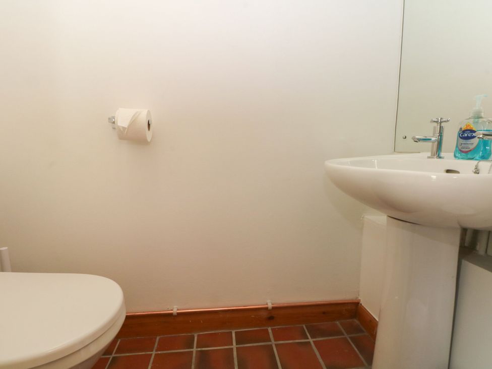 A bathroom with a toilet and sink at Pearls Farm Two in Wildboarclough near Macclesfield