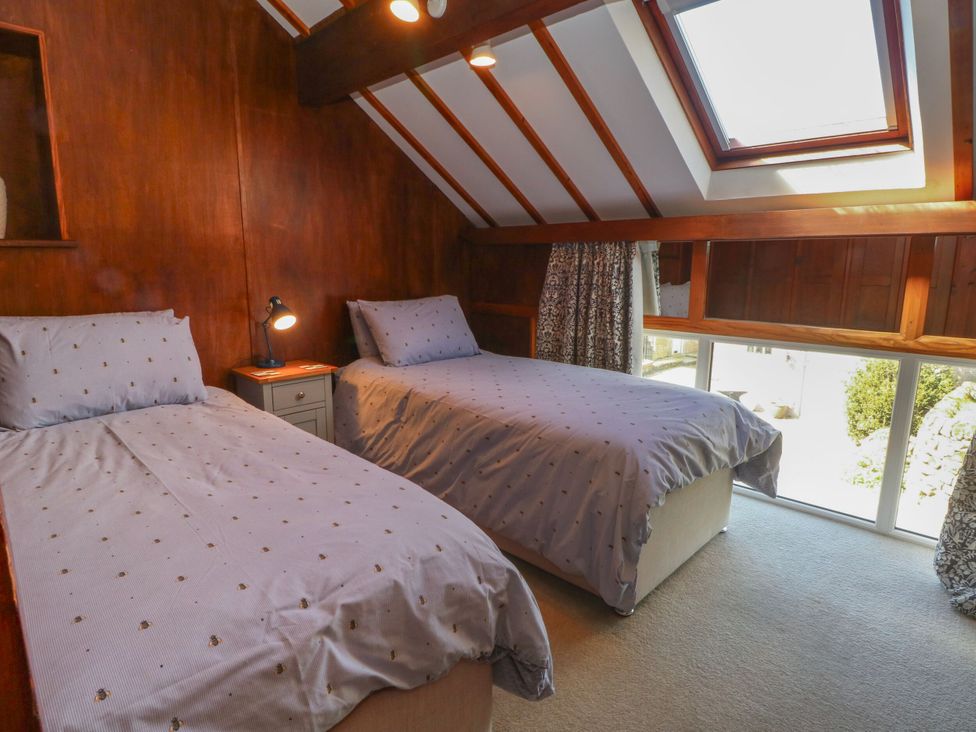 A bedroom with two beds and a nightstand at Pearls Farm Two Wildboarclough near Macclesfield