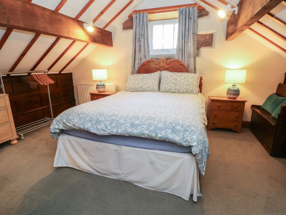 A bedroom with a bed and bedside tables at Pearls Farm Two Wildboarclough near Macclesfield