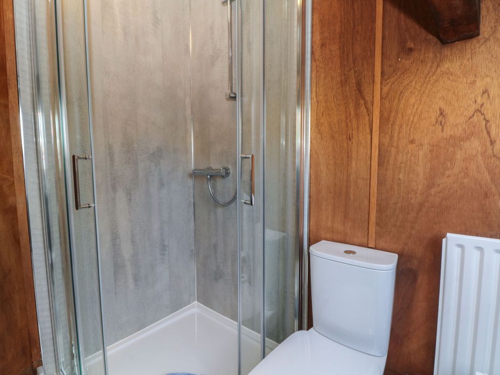 A bathroom with a shower and toilet at Pearls Farm Two Wildboarclough near Macclesfield