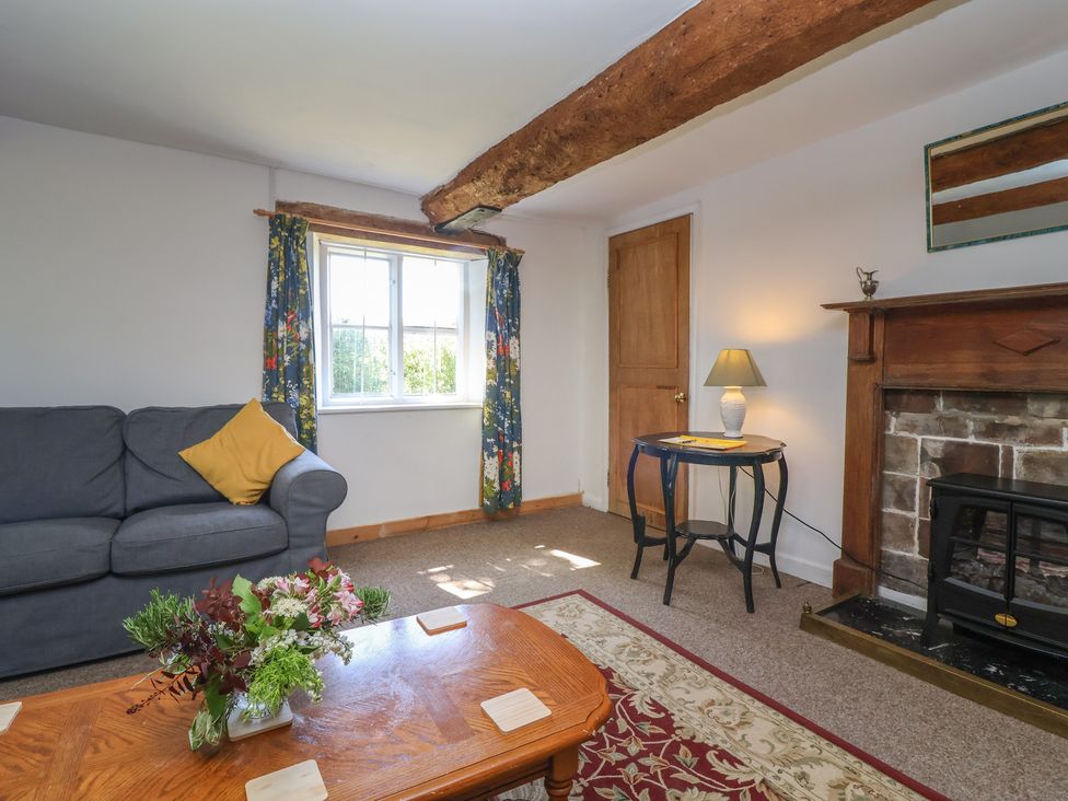 A living room with a sofa and coffee table at Walk House in Gloucester