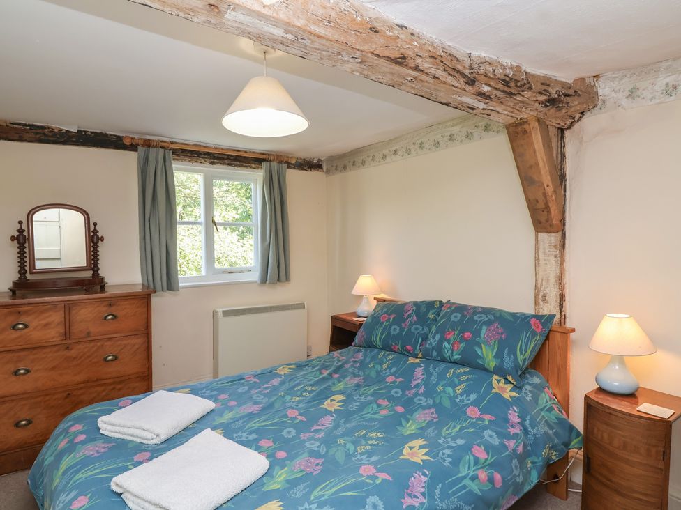 A bedroom with a bed and chest of drawers at Walk House in Gloucester