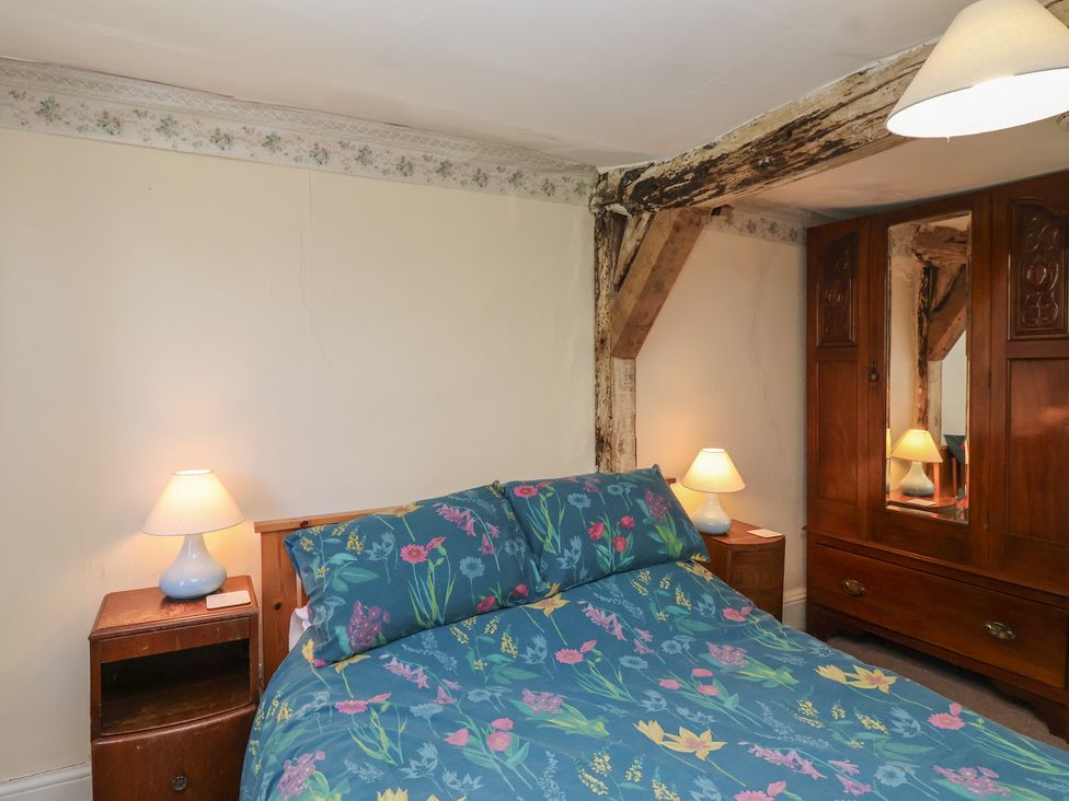 A bedroom with a bed and lamps at Walk House in Gloucester