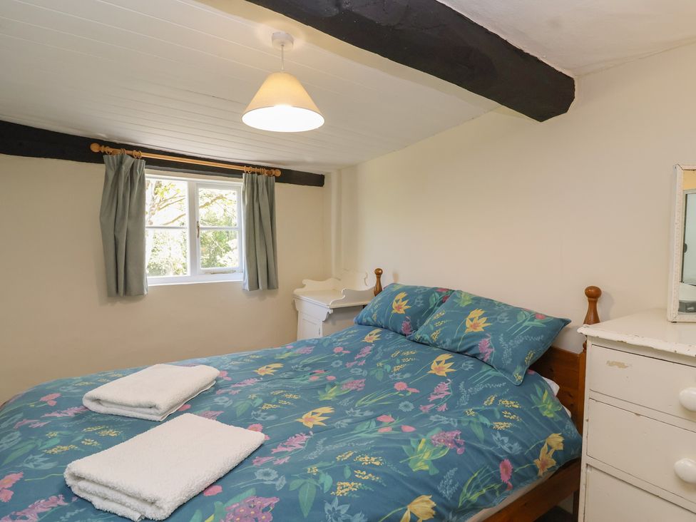 A bedroom with a bed and window at Walk House in Gloucester