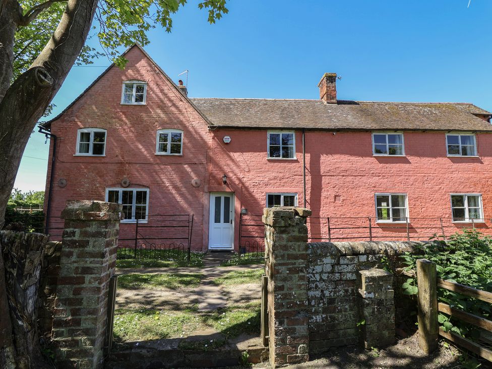 A house with a garden path and fence at Walk House in Gloucester