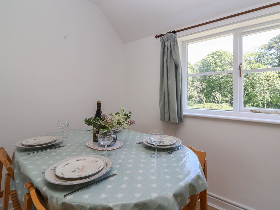 A dining room with a table set for a meal at Walk Farm Cottage in Gloucester