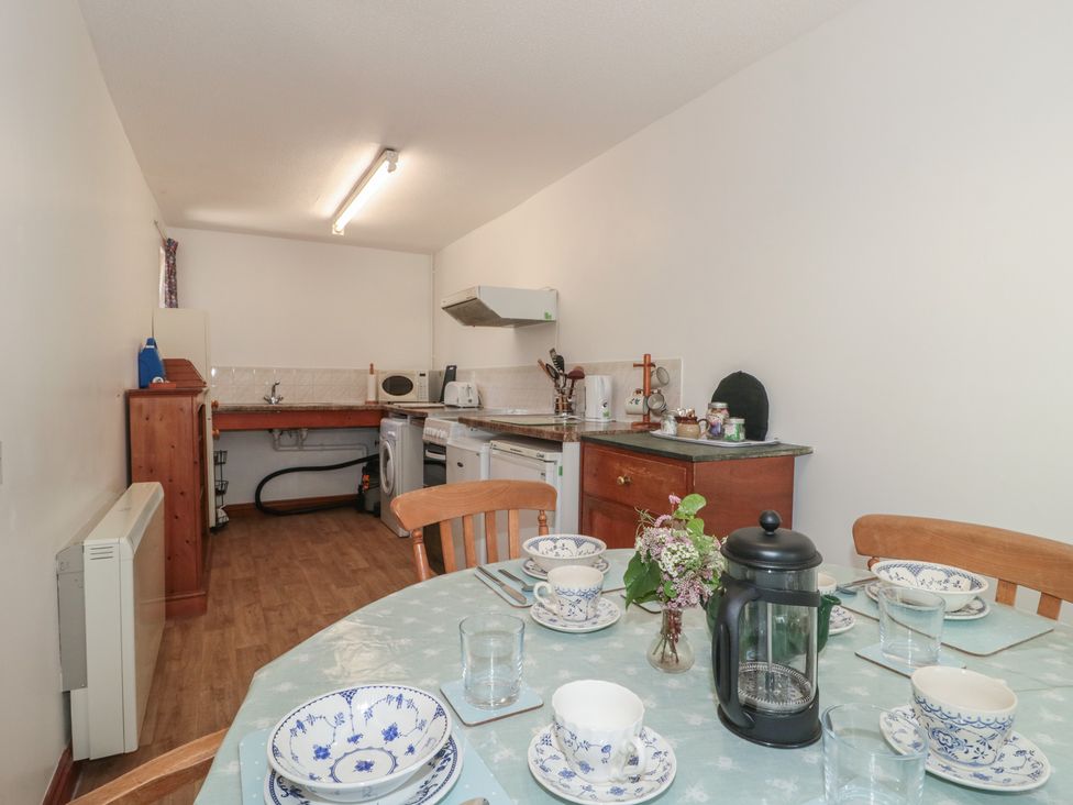 A kitchen with dining table set at Walk Close in Gloucester