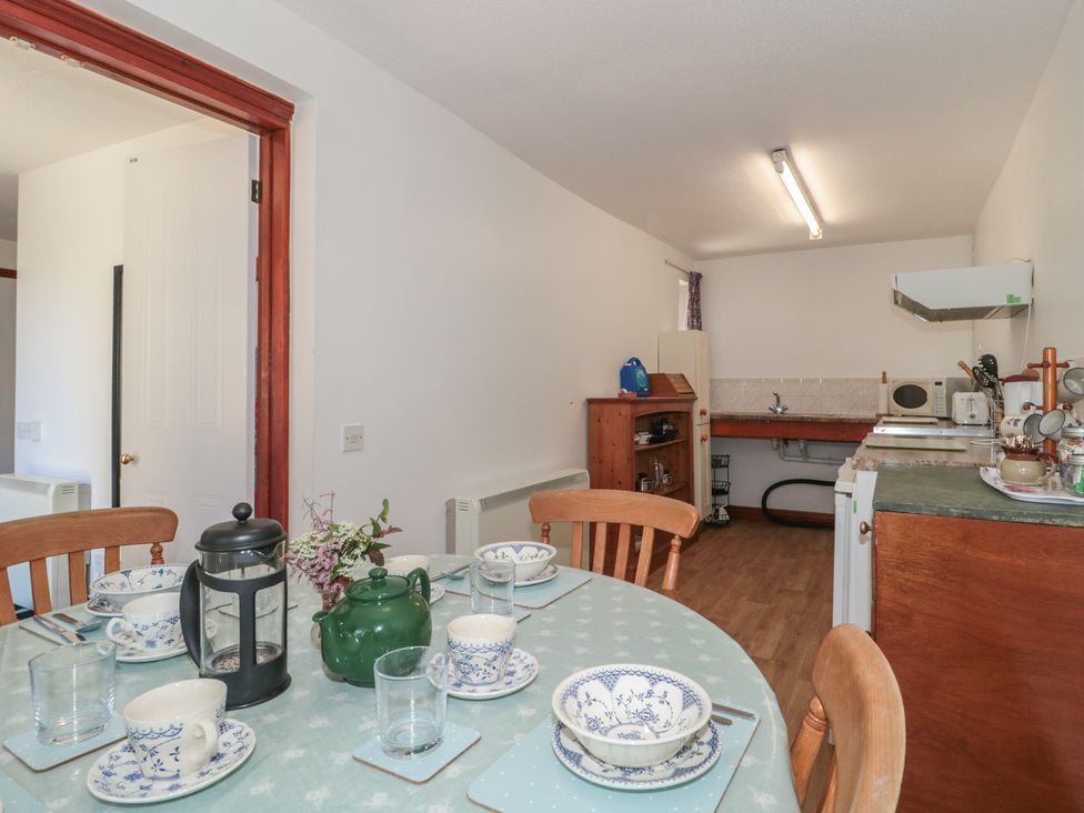 A kitchen with table set for coffee at Walk Close in Gloucester