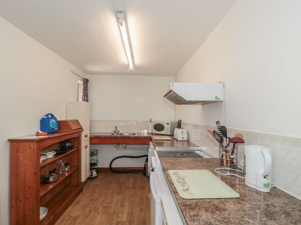 A kitchen with a sink and appliances at Walk Close in Gloucester