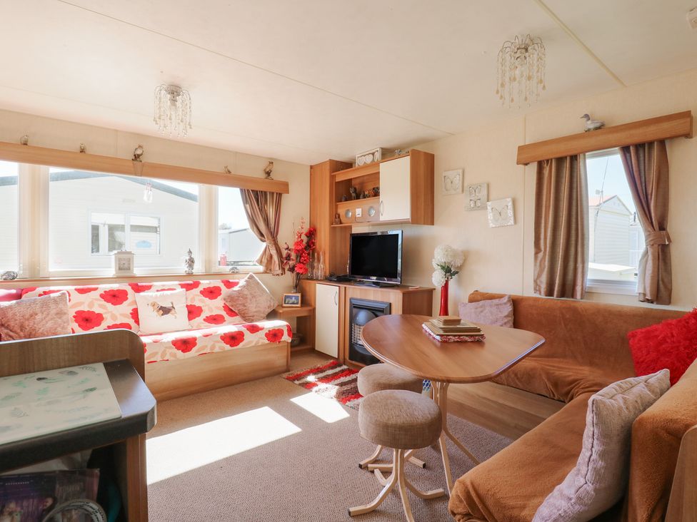 A living room with a sofa and coffee table at Valley Farm Number 448