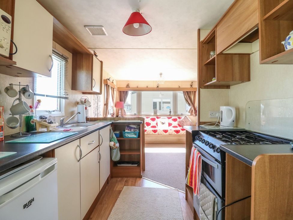 A kitchen with cabinets and appliances at Valley Farm Number 448
