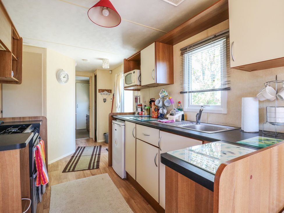 A kitchen with a sink and microwave at Valley Farm Number 448