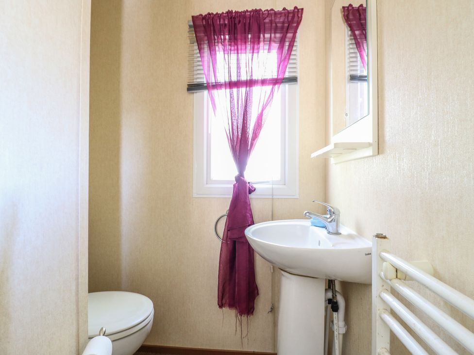 A bathroom with a toilet and sink at Valley Farm Number 448