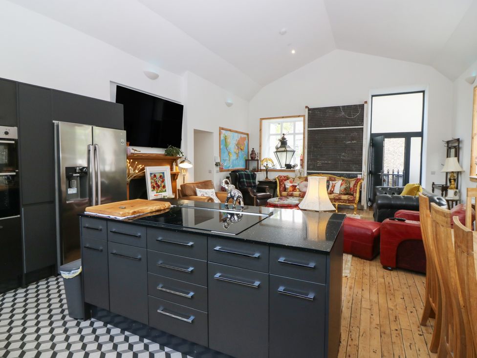A kitchen with an island and appliances at The Old School in Peebles