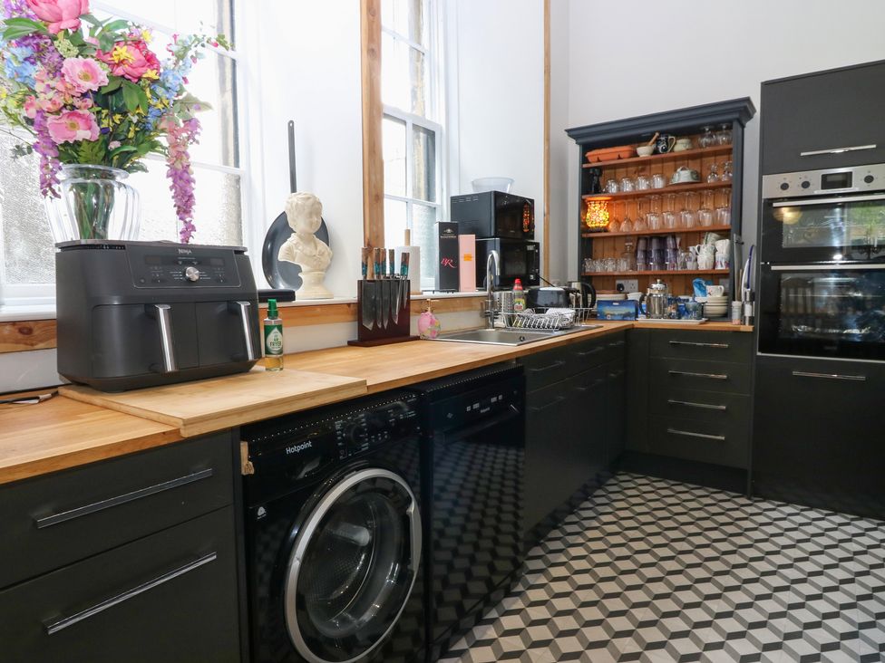 A kitchen with appliances and a countertop at The Old School in Peebles