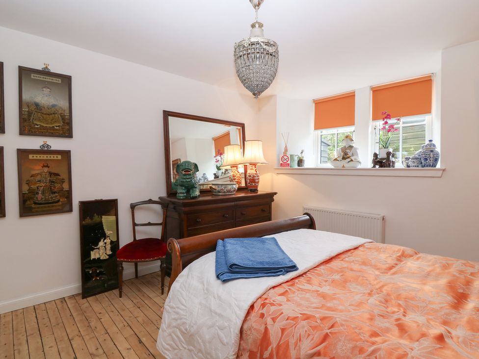 A bedroom with a bed and chest of drawers at The Old School in Peebles