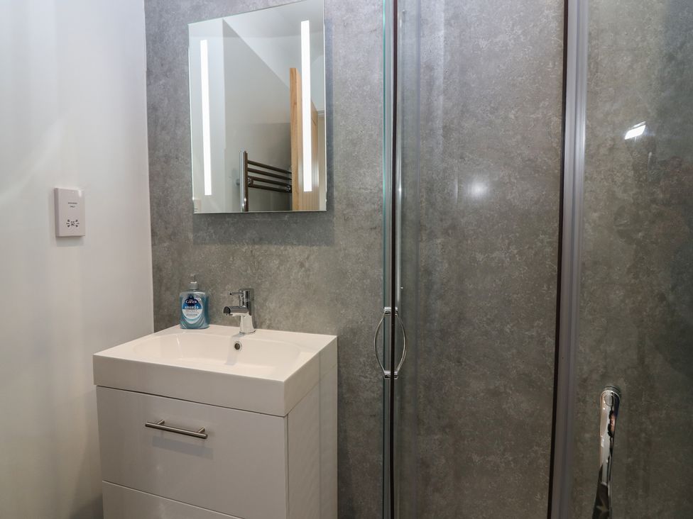 A bathroom with a sink and shower at The Old School in Peebles