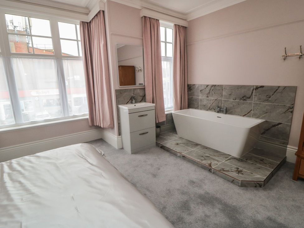 A bathroom with a bathtub and sink at 5 Station Avenue