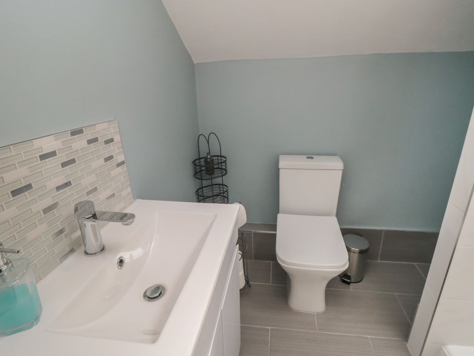 A bathroom featuring a sink and toilet at 5 Station Avenue