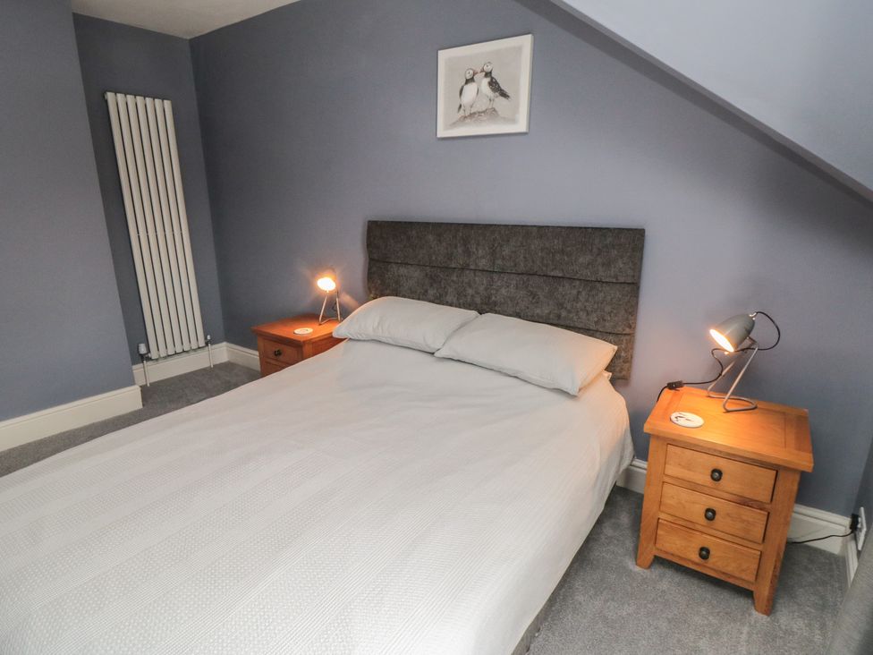 A bedroom with a double bed and bedside tables at 5 Station Avenue