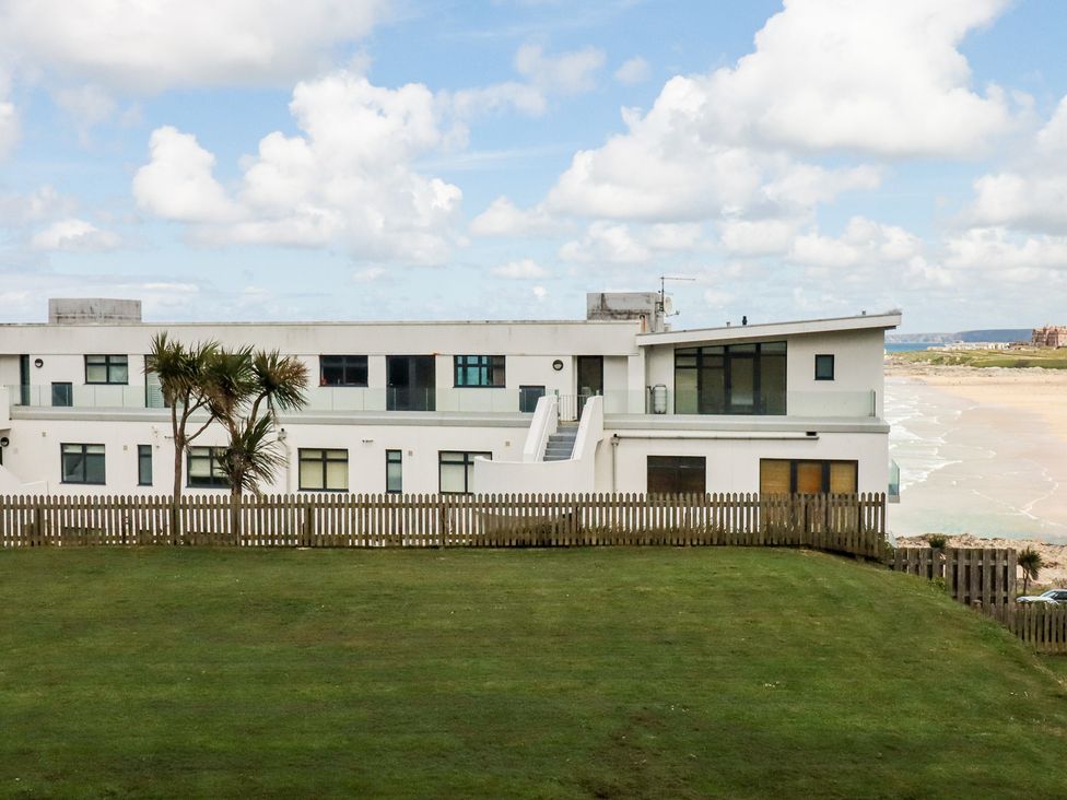 An outdoor view of a building with a lawn at A5 Bay Apt.