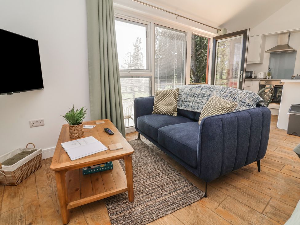 A living room with a sofa and a coffee table at Willow in Barnstaple