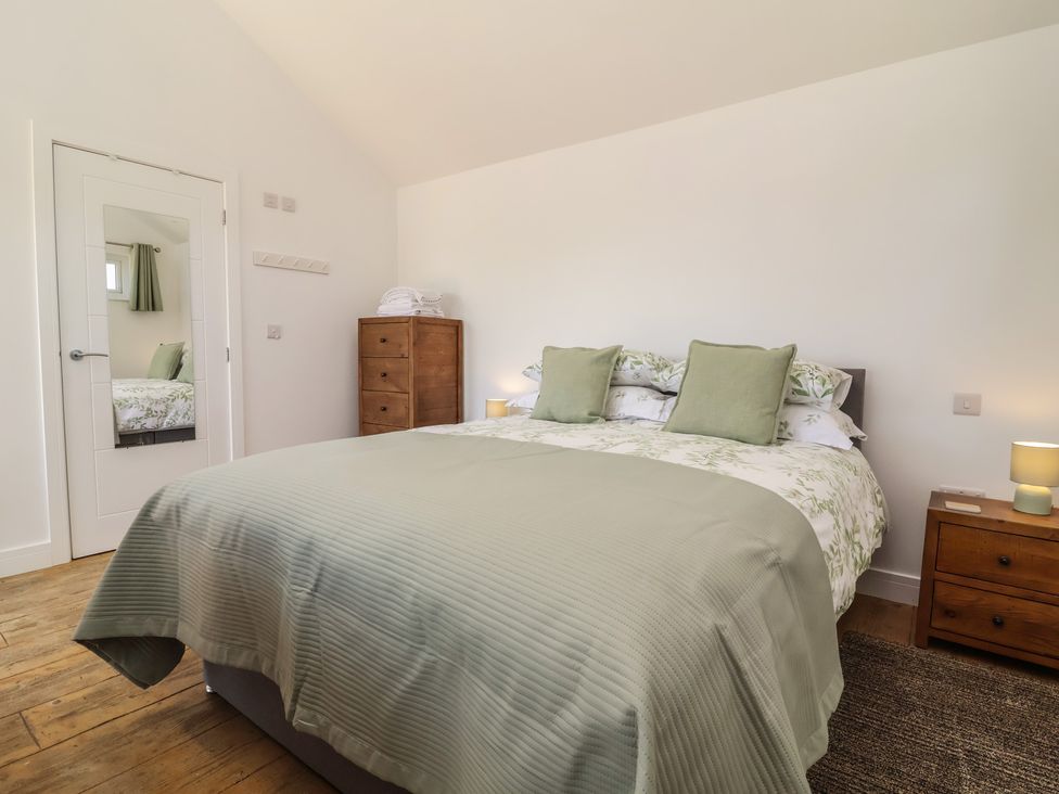 A bedroom with a bed and bedside table at Willow in Barnstaple