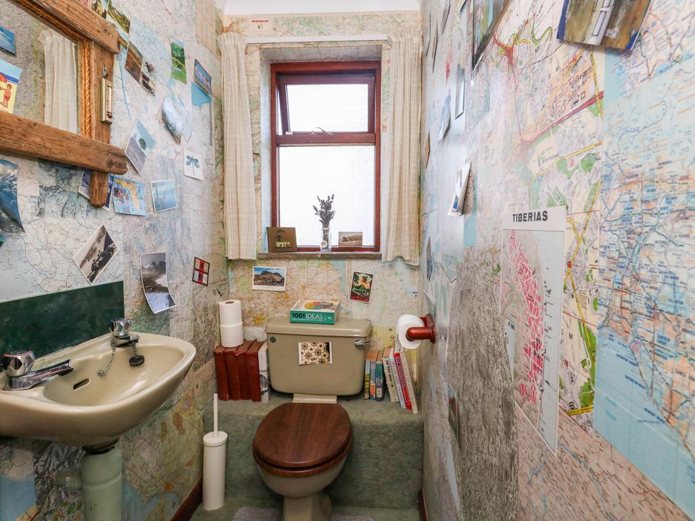 A bathroom with a toilet and sink at Dunvant in Swanage