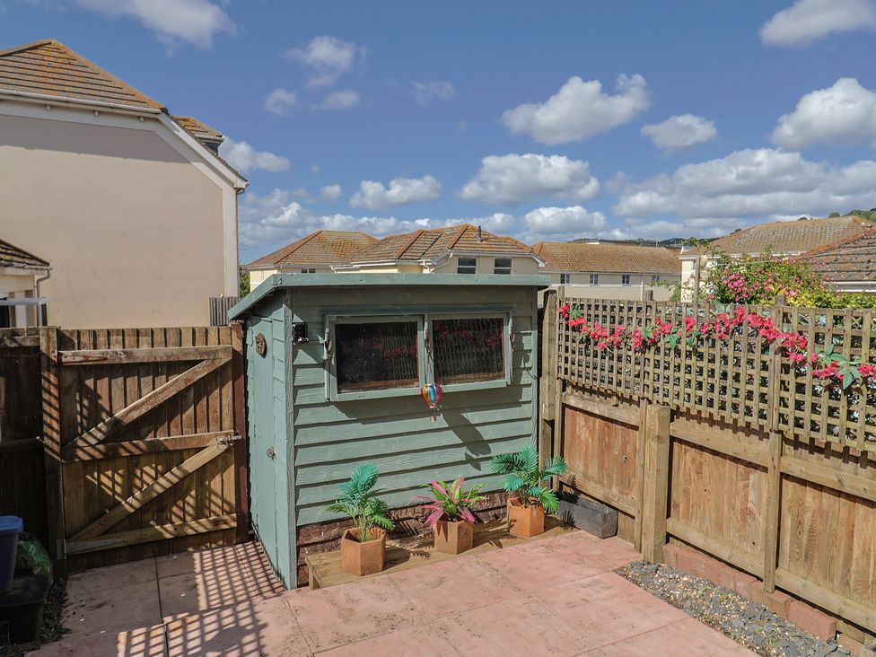 A garden with a shed and plants at 2 Lyme Mews Seaton