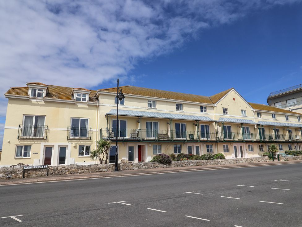 A building with multiple balconies and windows at 2 Lyme Mews in Seaton