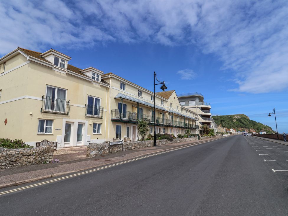 A photo of houses along a road near the sea at 2 Lyme Mews Seaton