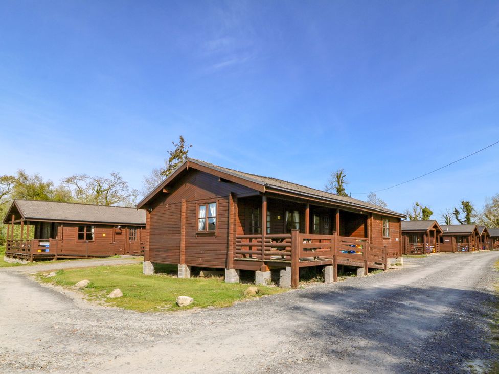 A group of cabins with a pathway at Lodge 9 - Sleep 4 - Double and Twin in Criccieth