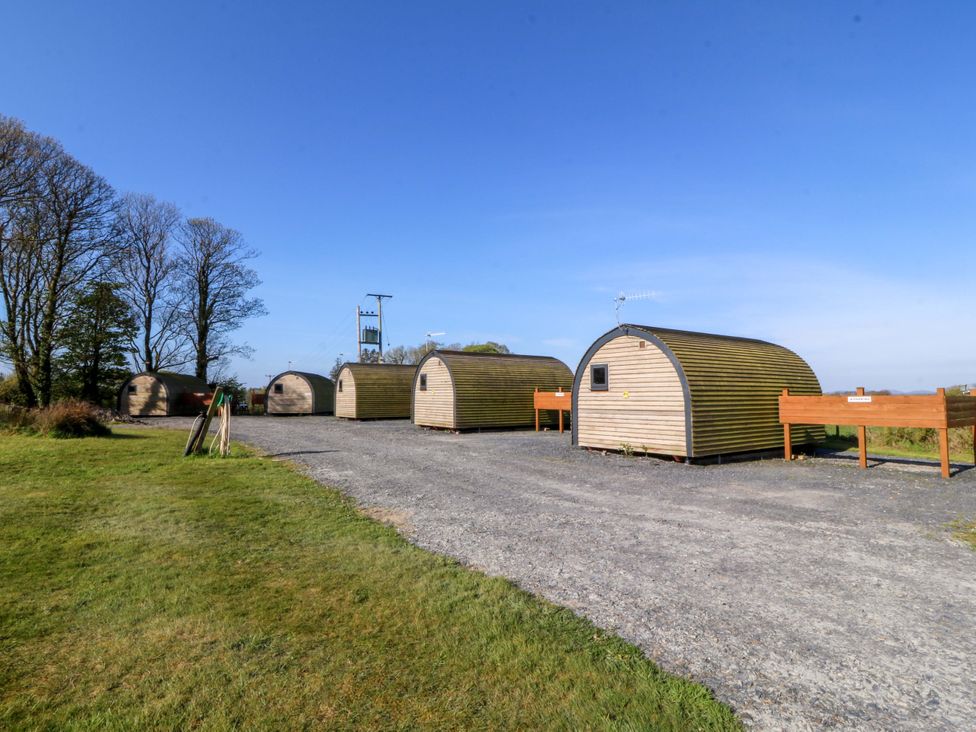 An outdoor area with multiple cabins at Bron Eifion Pod 3 Criccieth