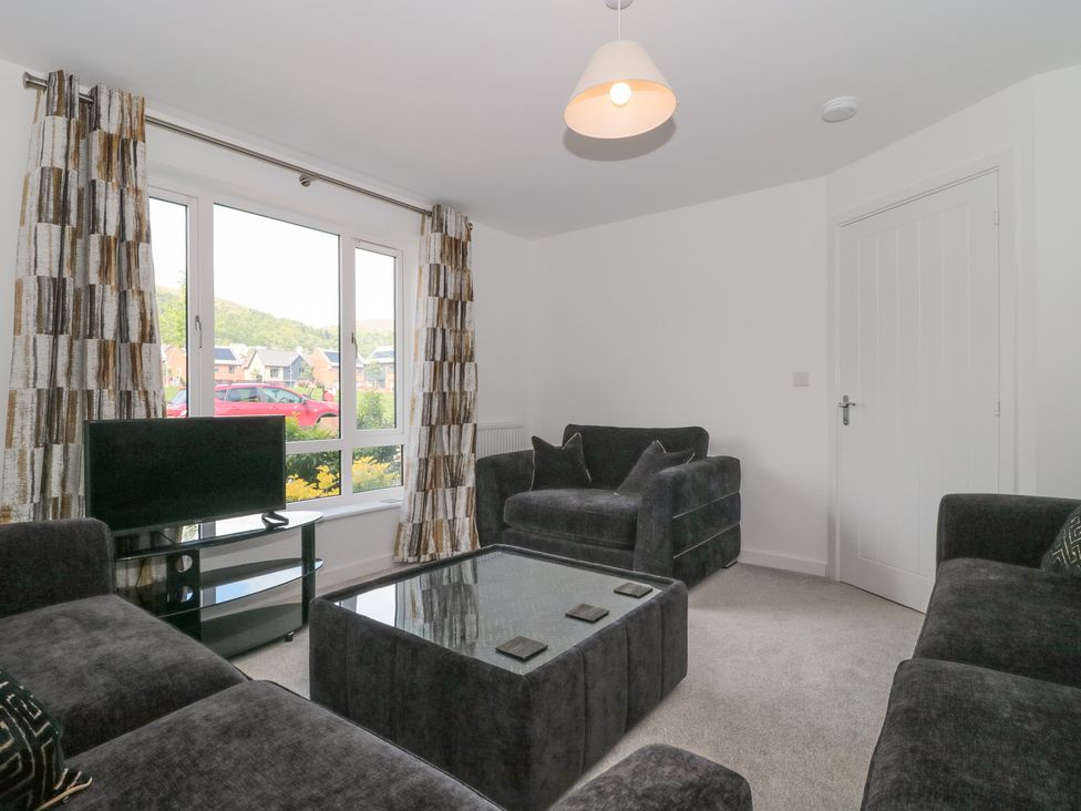 A living room with a coffee table and television at 56 Strothers Avenue Malvern