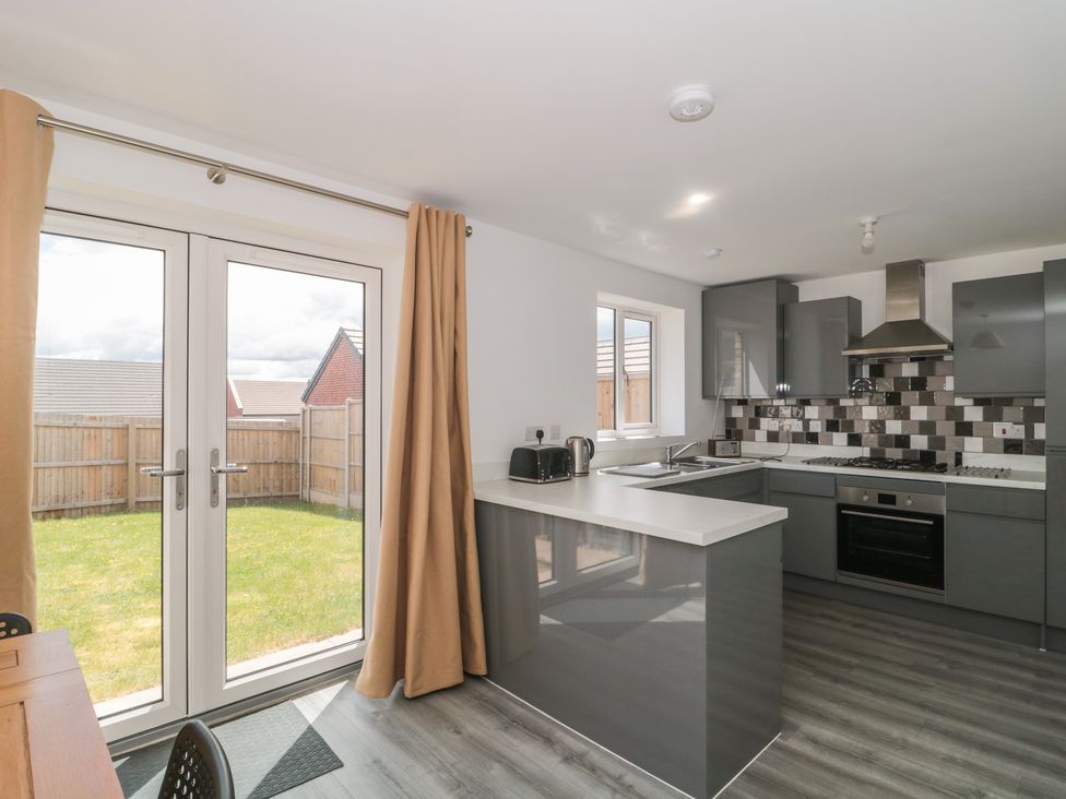 A kitchen with modern appliances and access to the garden at 56 Strothers Avenue in Malvern