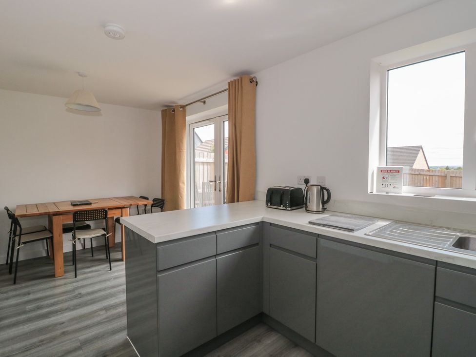 A kitchen with a table and chairs at 56 Strothers Avenue Malvern