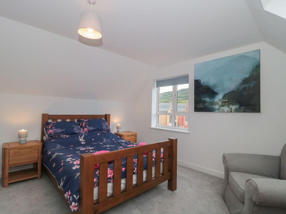 A bedroom with a bed and two bedside tables at 56 Strothers Avenue, Malvern